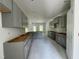 Spacious kitchen with gray cabinets, central island and natural light, perfect for cooking and entertaining at 507 Olivia Crossing Ct # 20, Four Oaks, NC 27524