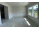 Bright living room with wall paneling detail to the wall and a large window under construction at 507 Olivia Crossing Ct # 20, Four Oaks, NC 27524