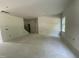 Spacious living room with large windows and an open staircase under construction at 507 Olivia Crossing Ct # 20, Four Oaks, NC 27524