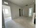 Open loft area featuring multiple doorways and plenty of natural light under construction at 507 Olivia Crossing Ct # 20, Four Oaks, NC 27524