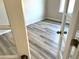 Stylish room showcases new light gray floors, perfect for a modern office or den at 507 Olivia Crossing Ct # 20, Four Oaks, NC 27524