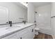 Modern bathroom featuring double sinks, granite countertop, shower and tub combination at 620 Gilmer St, Burlington, NC 27217