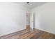 Bright bedroom features a neutral color palette, wood-look flooring, and an en-suite bathroom at 620 Gilmer St, Burlington, NC 27217