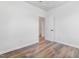 Bright bedroom features a neutral color palette, wood-look flooring, and an en-suite bathroom at 620 Gilmer St, Burlington, NC 27217
