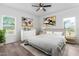 Cozy bedroom with a comfortable bed, artwork, and natural light from the windows at 620 Gilmer St, Burlington, NC 27217