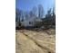 View of new construction featuring white siding, covered porch, and unfinished yard at 620 Gilmer St, Burlington, NC 27217