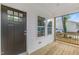 New construction home with a covered porch, dark front door, and wood railing at 620 Gilmer St, Burlington, NC 27217