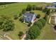 Aerial view of the home showcasing its well-manicured lawn, landscaping, and serene setting at 6489 Waters Edge Dr, Rocky Mount, NC 27803