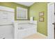 Bathroom features a walk-in shower, garden tub and leaf-motif wallpaper at 6489 Waters Edge Dr, Rocky Mount, NC 27803