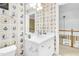 Bathroom featuring a white vanity with mirror, sailboat wallpaper, and access to the hallway at 6489 Waters Edge Dr, Rocky Mount, NC 27803