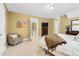 Bedroom featuring neutral carpet and walls with en-suite bathroom and seating area at 6489 Waters Edge Dr, Rocky Mount, NC 27803