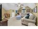 Bonus room with beige walls and carpet featuring a sectional sofa, ottoman, and unique architecture at 6489 Waters Edge Dr, Rocky Mount, NC 27803