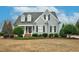 Charming gray two-story home with a well-manicured lawn and inviting front entrance at 6489 Waters Edge Dr, Rocky Mount, NC 27803