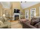 Inviting living room featuring a fireplace, hardwood floors, and ample seating at 6489 Waters Edge Dr, Rocky Mount, NC 27803