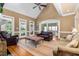 Bright living room with hardwood floors, vaulted ceiling, ample seating, and lots of natural light at 6489 Waters Edge Dr, Rocky Mount, NC 27803