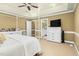 Large main bedroom has en-suite bathroom, tray ceiling, beige carpet and white dresser at 6489 Waters Edge Dr, Rocky Mount, NC 27803