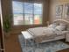 Bedroom featuring a large window and a comfortable bed with tasteful decor at 700 Finsbury St # 304, Durham, NC 27703