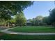 A tranquil green space with a gazebo and walking path surrounded by trees at 700 Finsbury St # 304, Durham, NC 27703