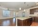 Cozy kitchen features granite countertops, stainless appliances and hardwood floors leading to a bright living area at 700 Finsbury St # 304, Durham, NC 27703
