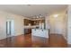 Open-concept kitchen featuring dark wood cabinets, stainless steel appliances, granite countertops, and hardwood floors at 700 Finsbury St # 304, Durham, NC 27703