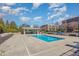 Community pool on a sunny day with lounge seating and a shaded structure at 700 Finsbury St # 304, Durham, NC 27703