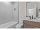 Modern bathroom features marble tile and tub at 80 Carnation Rd, Youngsville, NC 27596
