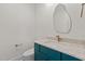 Stylish powder room with a marble countertop and a unique mirror at 80 Carnation Rd, Youngsville, NC 27596