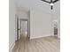Spacious room with modern floors and a glimpse into the bathroom at 80 Carnation Rd, Youngsville, NC 27596