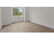 Bedroom with large window showing nature at 80 Carnation Rd, Youngsville, NC 27596