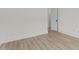 Bright, empty bedroom with hardwood floors and white trim at 80 Carnation Rd, Youngsville, NC 27596