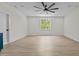 Open bedroom with wood-style flooring, a ceiling fan, and natural light at 80 Carnation Rd, Youngsville, NC 27596