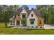 Beautifully designed two-story home with wood and white siding and a well-manicured lawn at 80 Carnation Rd, Youngsville, NC 27596