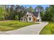 View of home's front exterior featuring a well-manicured lawn, driveway, and wood and white siding at 80 Carnation Rd, Youngsville, NC 27596