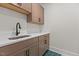 Modern laundry room with stylish cabinets and countertop at 80 Carnation Rd, Youngsville, NC 27596