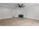 Bright living area with wood-look floors and a wet bar with teal cabinets at 80 Carnation Rd, Youngsville, NC 27596