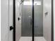 Sleek bathroom with a frameless glass shower and modern tile at 80 Carnation Rd, Youngsville, NC 27596