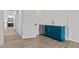 Stylish bar area with teal cabinets and a modern mini-fridge at 80 Carnation Rd, Youngsville, NC 27596