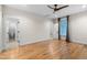 Open bedroom with hardwood floors and ensuite bathroom at 917 S Blount St, Raleigh, NC 27601
