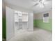 Spacious bedroom featuring an open closet with shelving and a window allowing natural light at 917 S Blount St, Raleigh, NC 27601