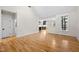 Open living space with hardwood floors, natural light, and a view into the kitchen at 917 S Blount St, Raleigh, NC 27601