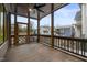 Screened-in porch with wood-paneled ceiling and railings offering views of the neighborhood at 917 S Blount St, Raleigh, NC 27601