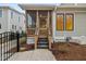 Screened-in porch with steps leading down, enclosed for enjoying outdoor living bug-free at 917 S Blount St, Raleigh, NC 27601