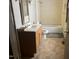 Functional bathroom showcasing a vanity, toilet, and tub, ready for renovation and customization at 922 N White St, Wake Forest, NC 27587
