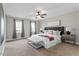 This main bedroom features neutral walls and a ceiling fan at 110 White Bloom Ln, Cary, NC 27519