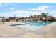 Community pool surrounded by lounge area and lush landscaping on a sunny day at 110 White Bloom Ln, Cary, NC 27519