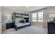 Bedroom featuring a bunk bed, hardwood floors, a window and modern decor at 116 Magma Ln, Holly Springs, NC 27540