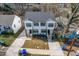 Aerial view of a house with a well-kept lawn and a nearby street at 1211 N Guthrie Ave, Durham, NC 27703
