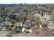 An aerial view of a neighborhood featuring rooftops, trees, and city skyline at 1211 N Guthrie Ave, Durham, NC 27703