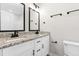 Bathroom featuring double vanities with granite countertops and modern fixtures at 1211 N Guthrie Ave, Durham, NC 27703