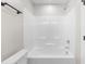 Bright bathroom featuring a full tub and shower with modern fixtures at 1211 N Guthrie Ave, Durham, NC 27703